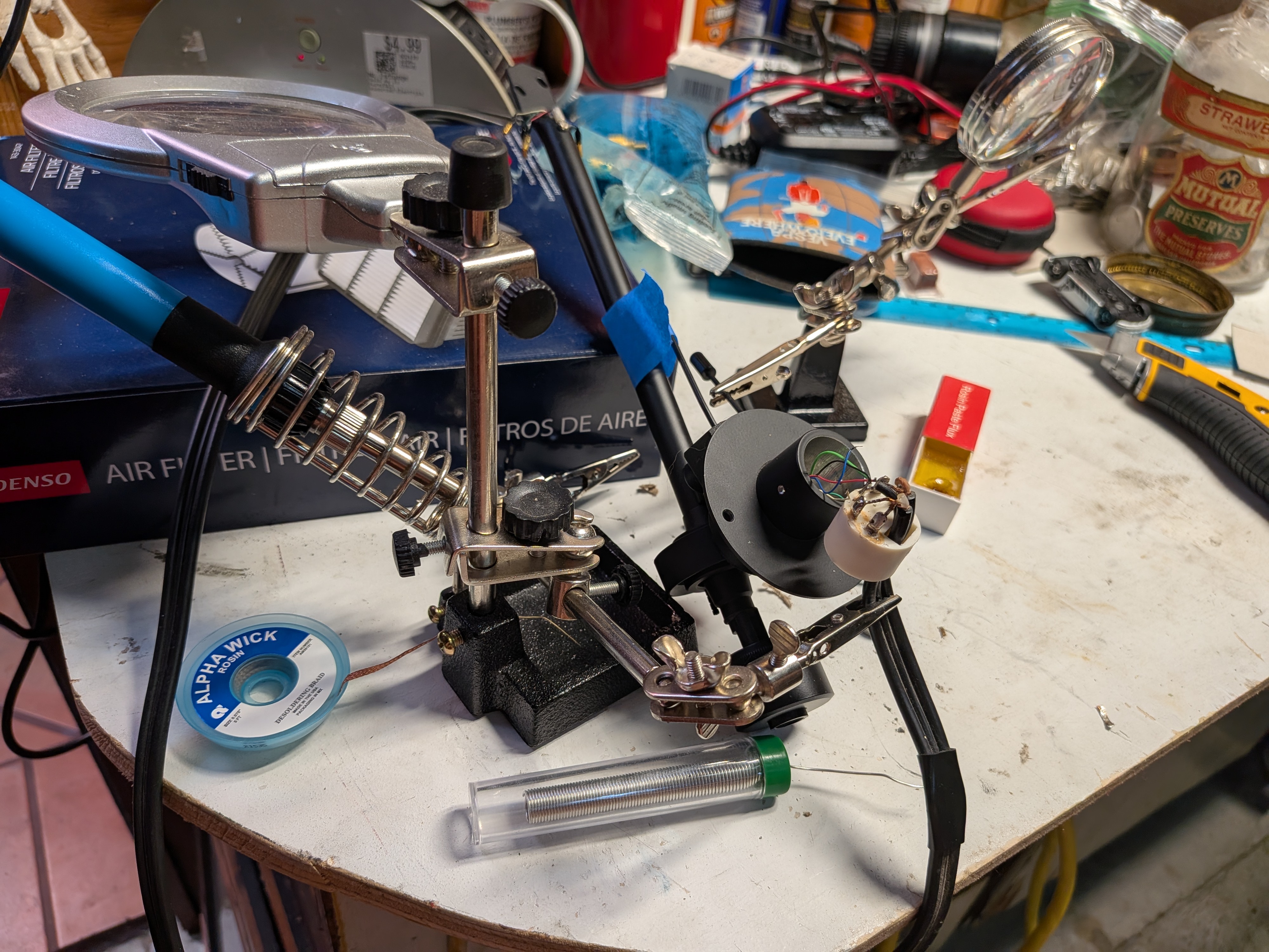Vintage turntable tonearm wiring repair on the workbench